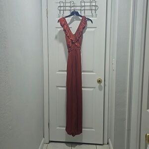 Wide leg flowy jumpsuit with ruffles at the neck